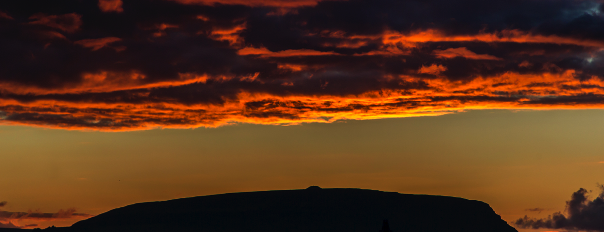 Cover image of orange sky over horizon